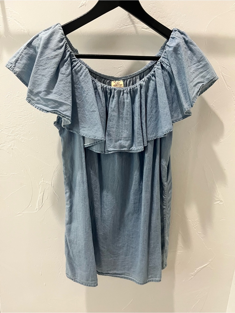 Women’s light blue top.